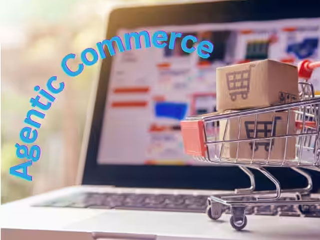 Laptop displaying an online shopping page with a miniature cart carrying a cardboard box, and blue curved 'Agentic Commerce' text across the top.